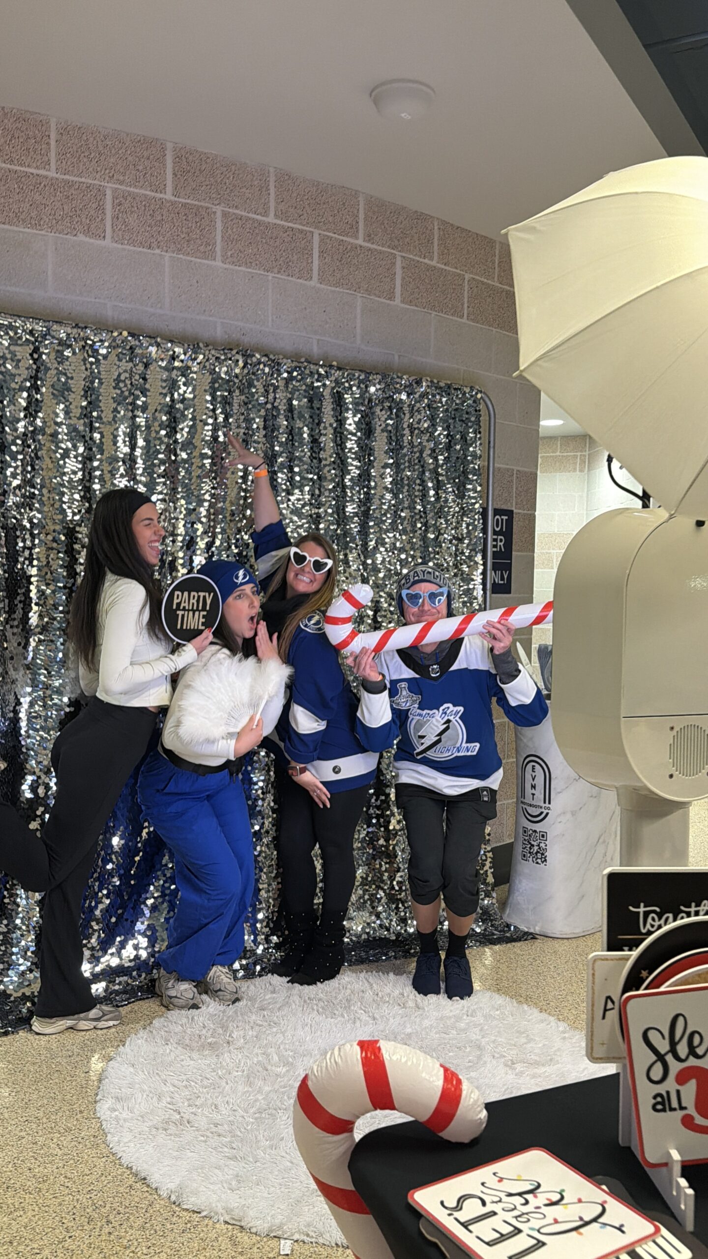 People Posing in a Photo Booth at tampa bay florida benchmark arena