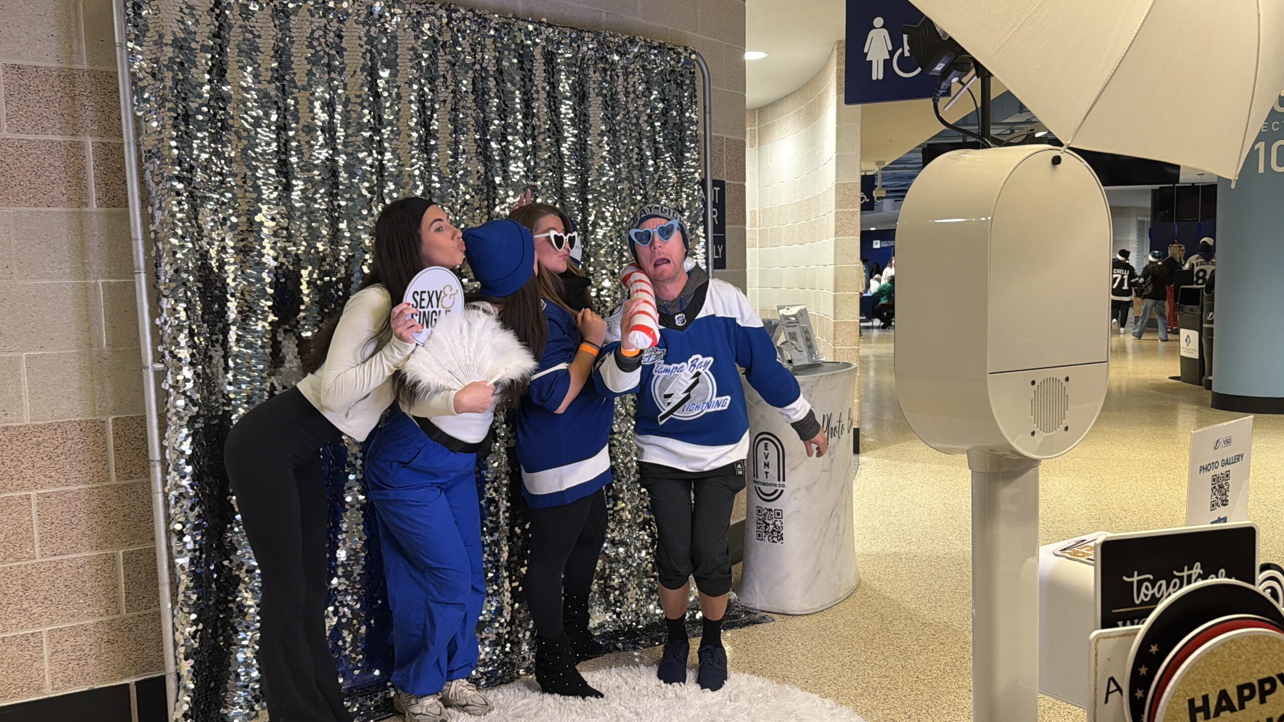 People Posing in a Photo Booth at tampa bay florida benchmark arena