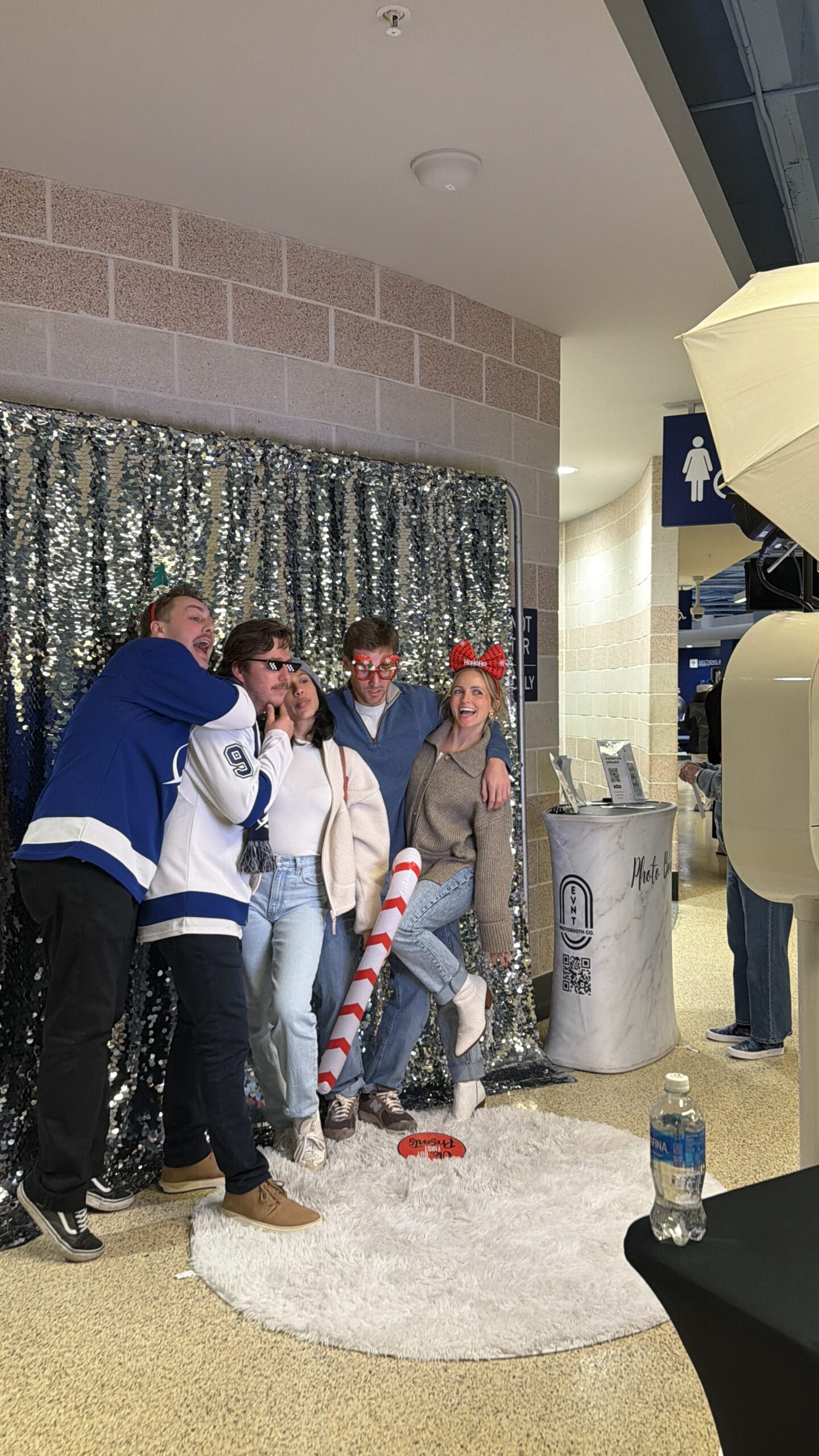 People Posing in a Photo Booth at tampa bay florida benchmark arena