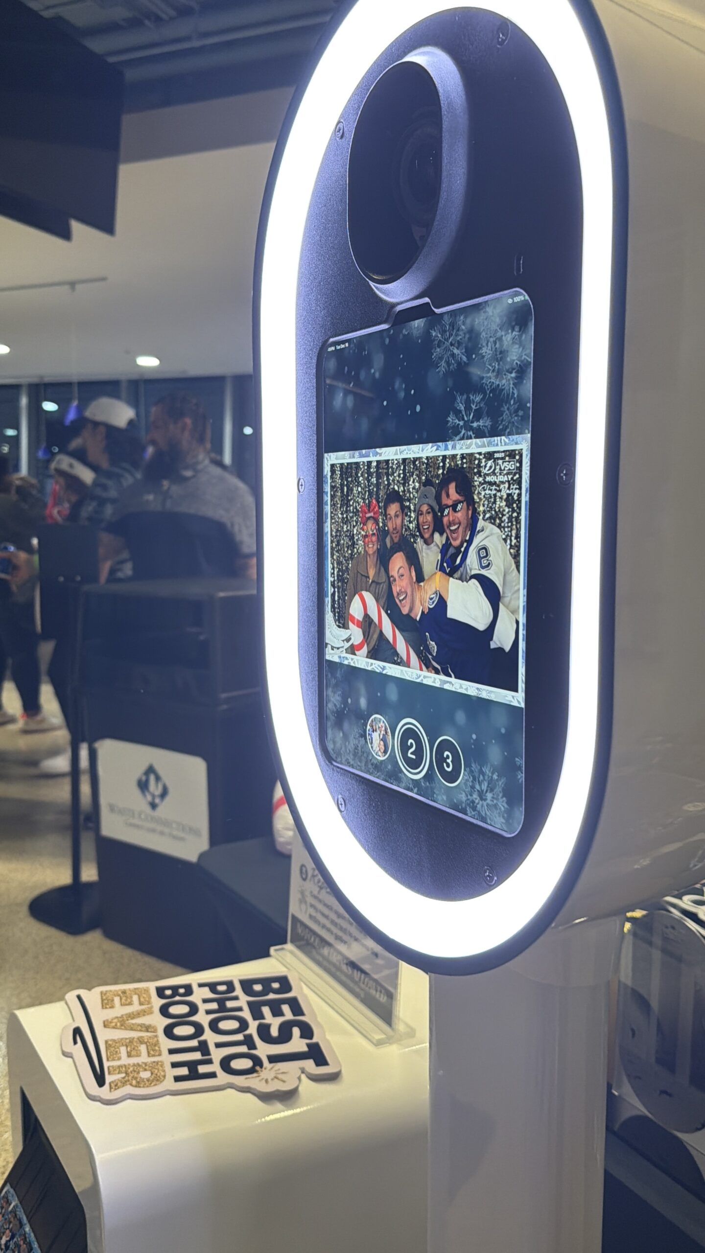 People Posing in a Photo Booth at tampa bay florida benchmark arena