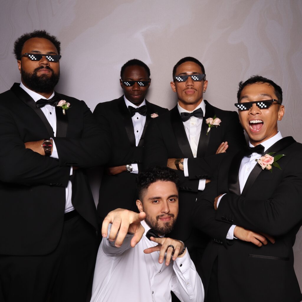 groomsmen posing in Photo Booth at white rock canyon in bushnell, fl