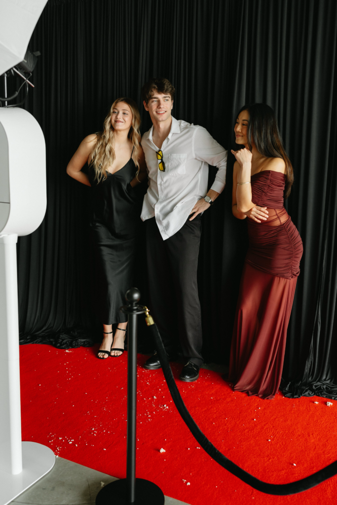 posing in Photo Booth with Photo Booth prints at event in tampa bay fl